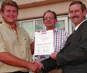 Formalising customer commitment with the quality management standard ISO 9001:2000 certificate awarded to Optron. From left: Trevor Venter, Optron managing director; Faan Malan, human resources and quality manager at Optron; and William Kennedy, BVQI lead auditor